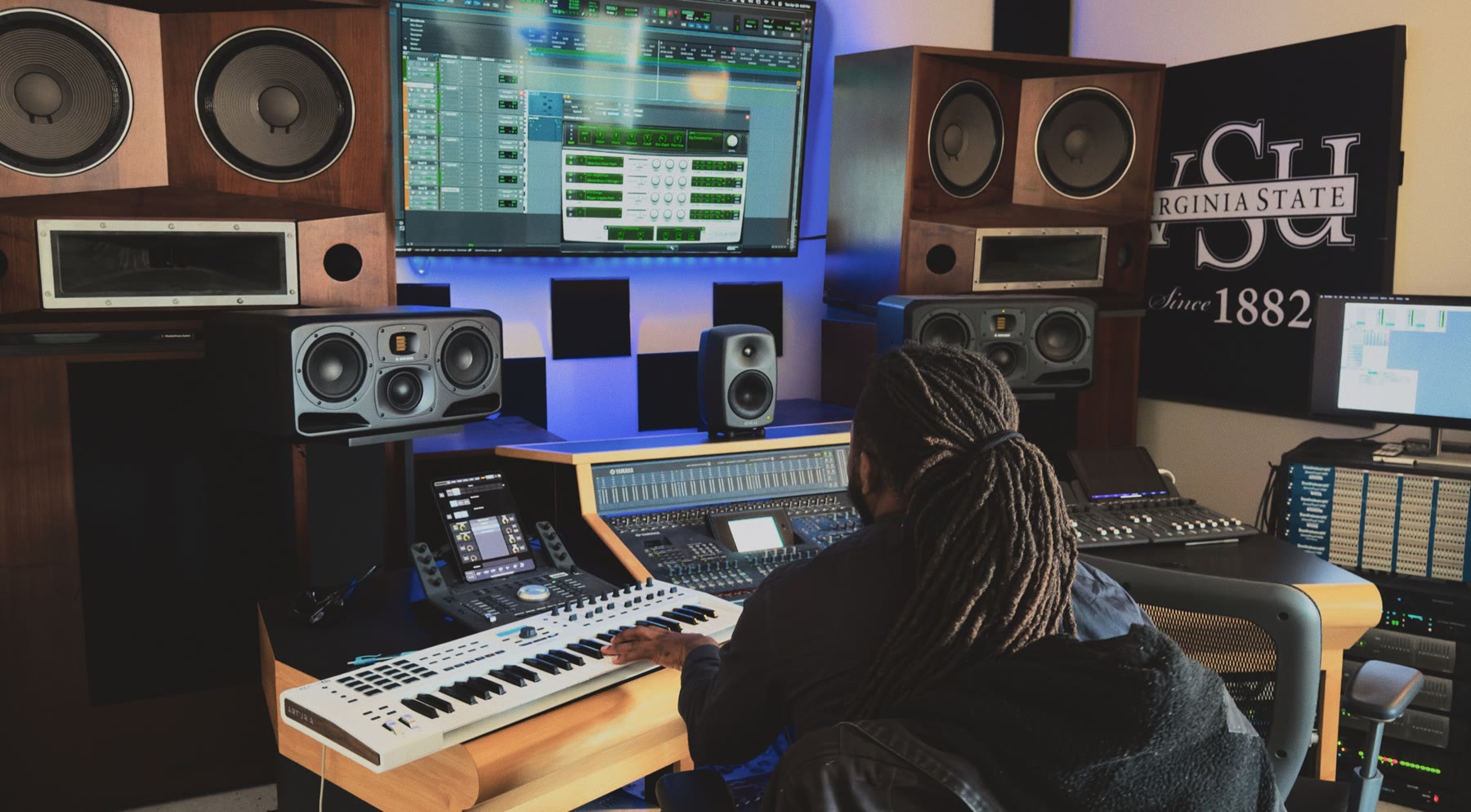 Music Production Technology student creating at the Davis Hall 110 studio workstation